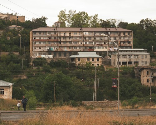 People walking on road near building during daytime — Lahij, Azerbaijan