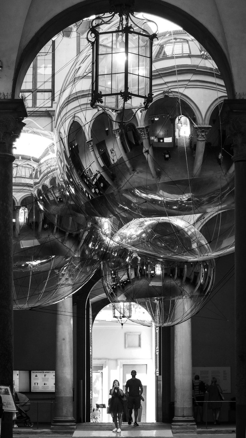 grayscale photo of clear glass ball