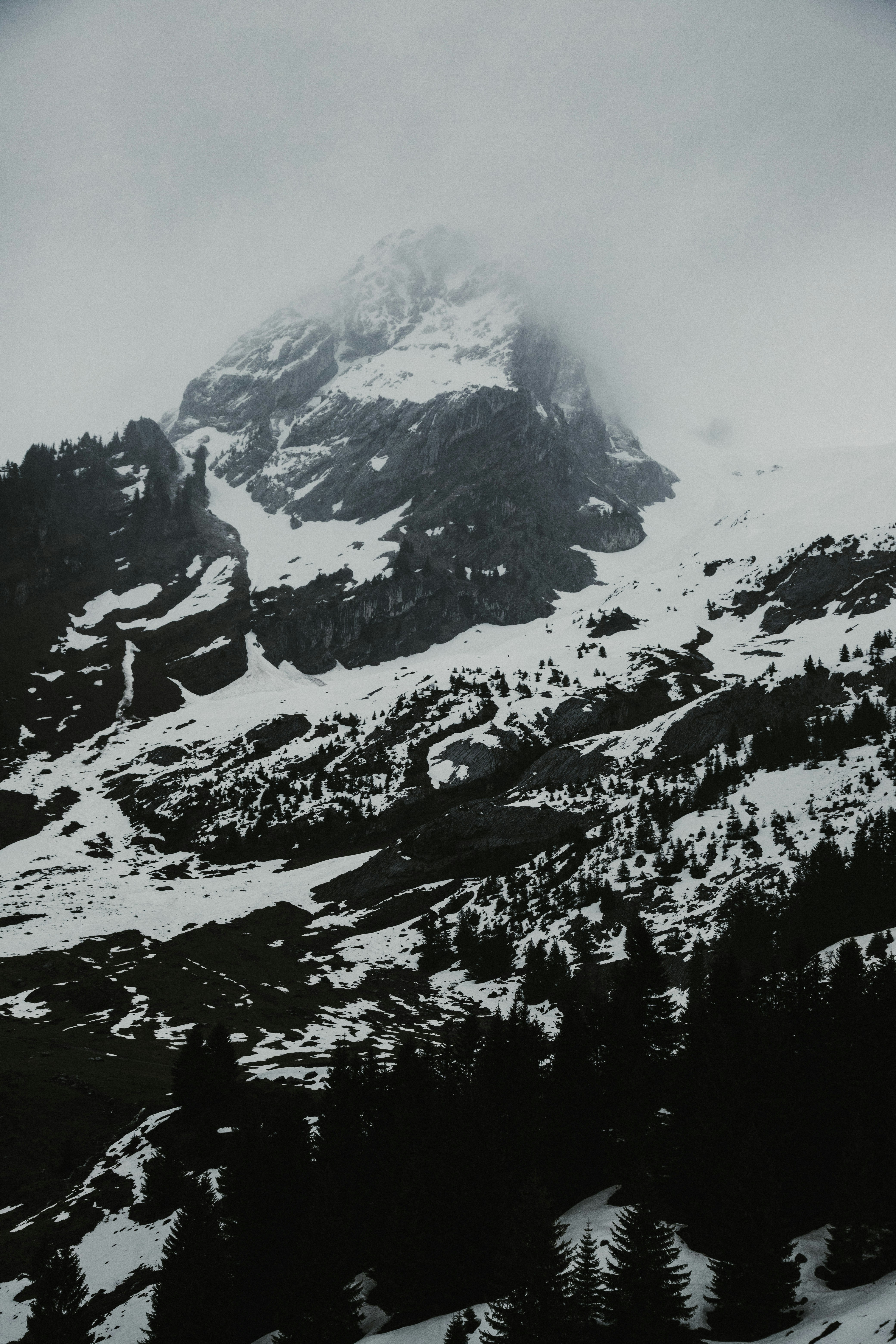 snow covered mountain during daytime