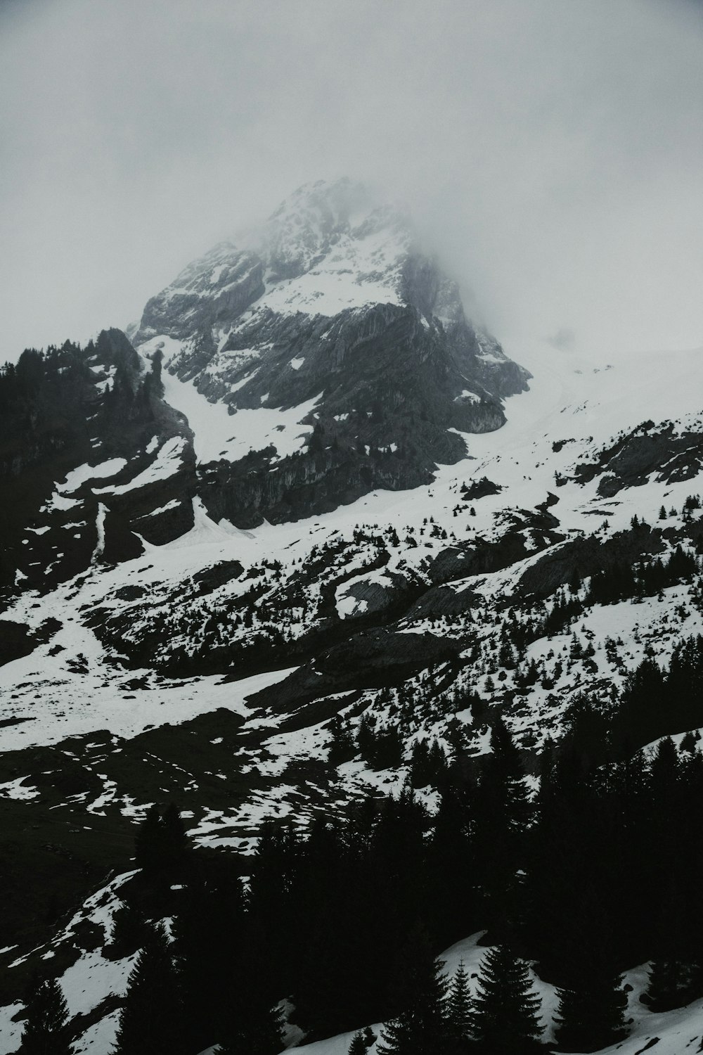 snow covered mountain during daytime