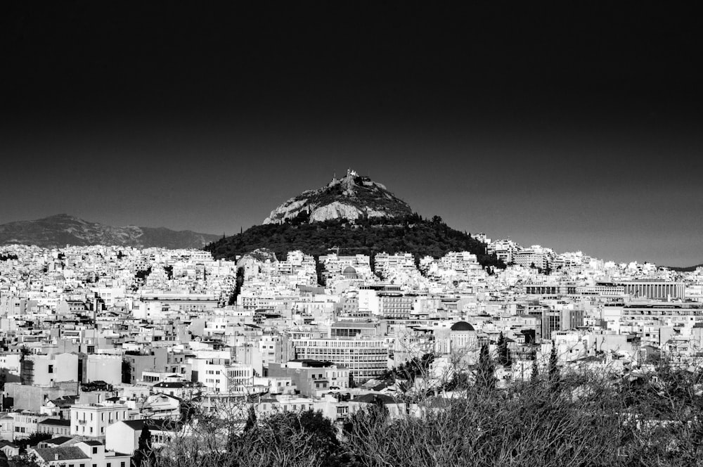 grayscale photo of city buildings