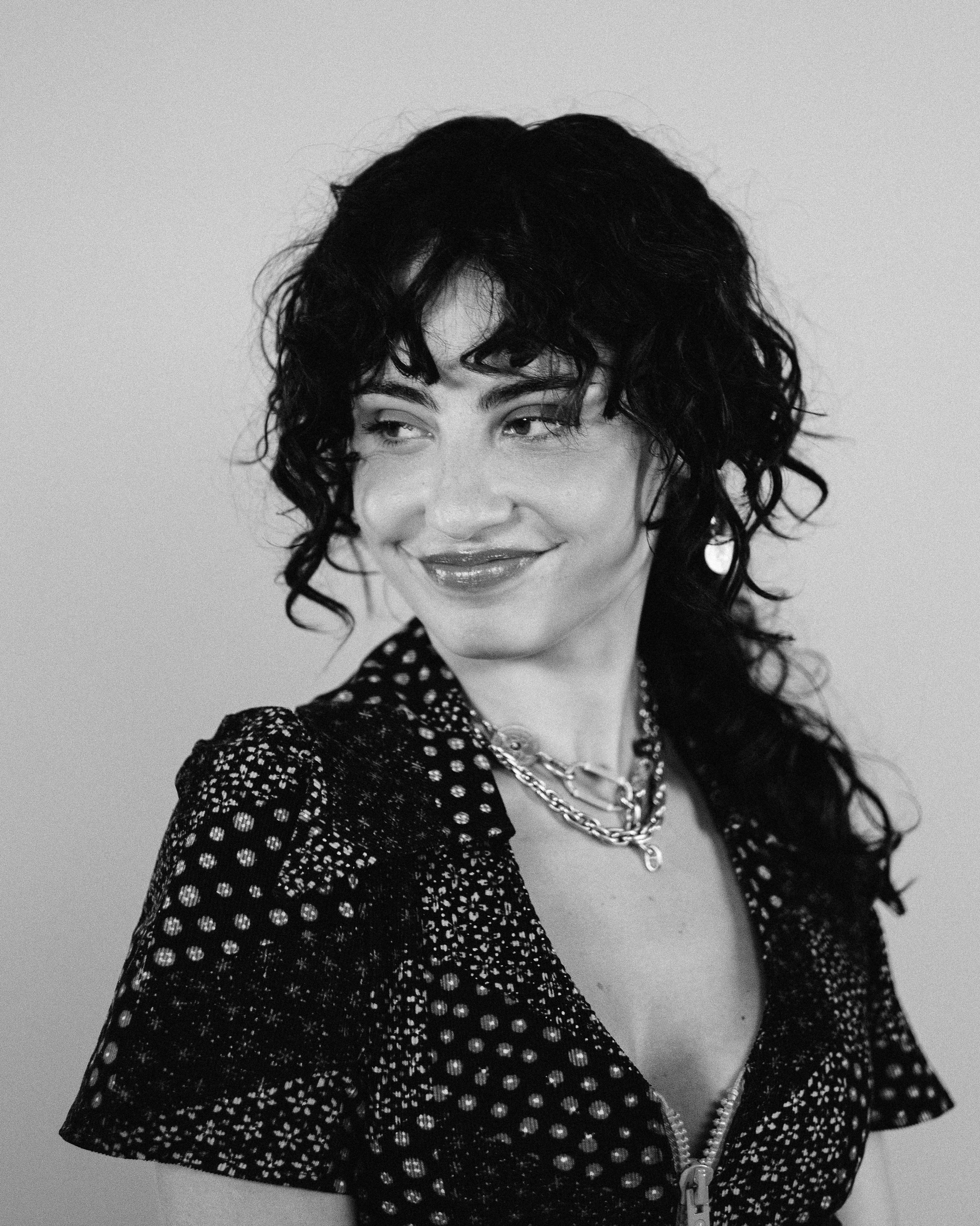 woman in black and white polka dot shirt