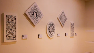 A series of original paintings arranged to emphasize their unique limited edition numbers.