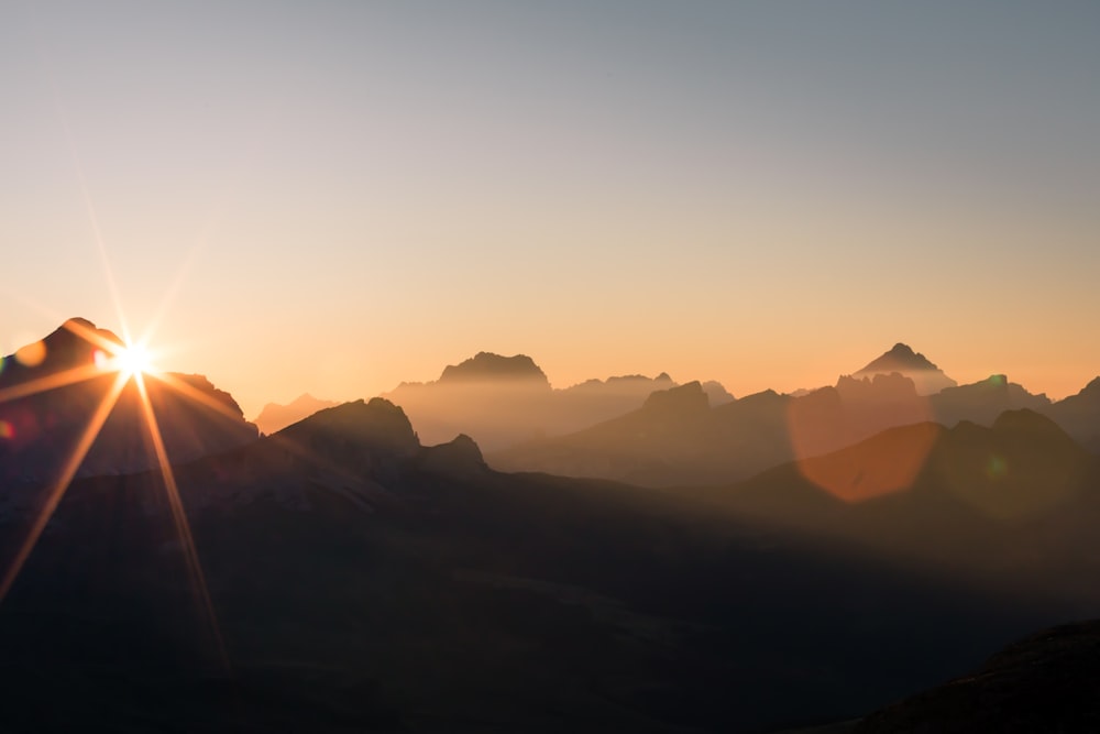 silhouette of mountains during sunset