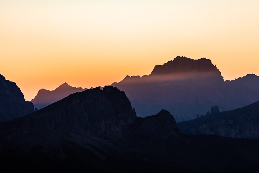 silhouette of mountains during sunset