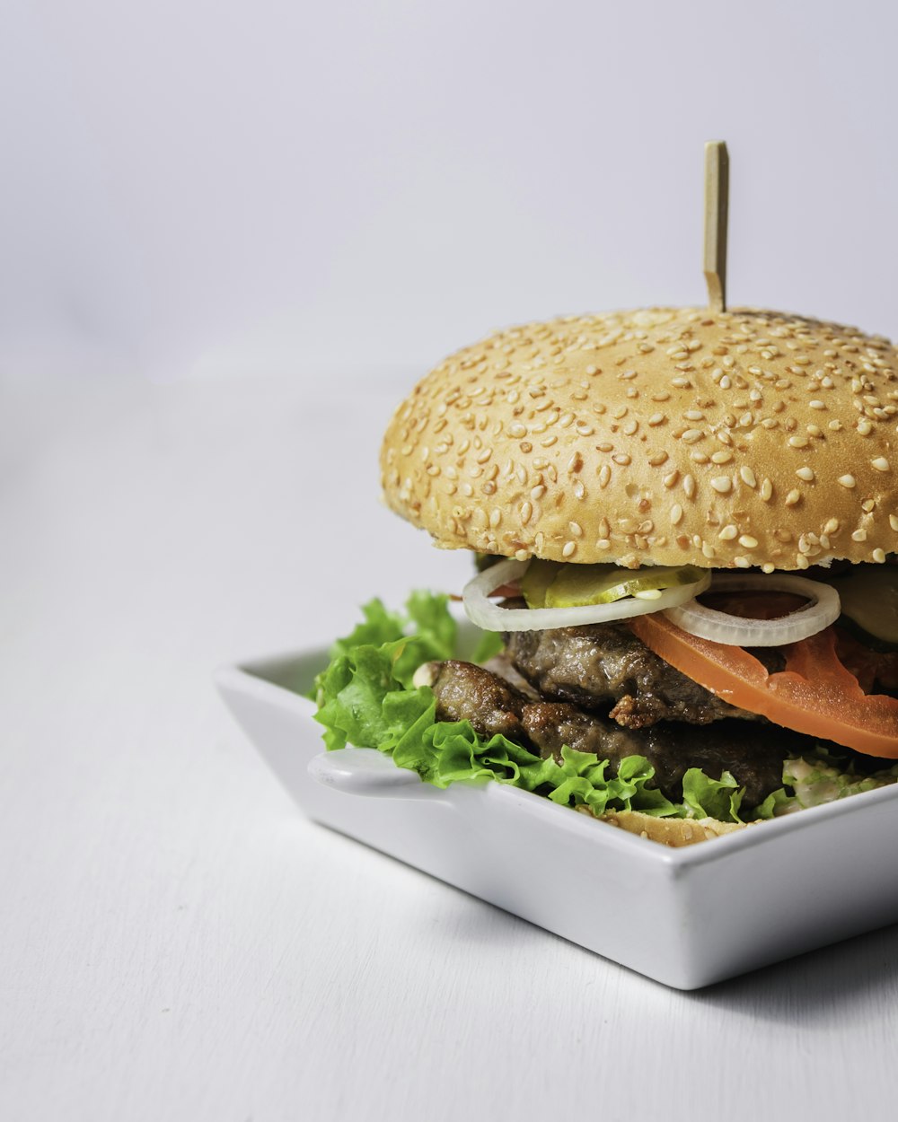 burger on white ceramic plate