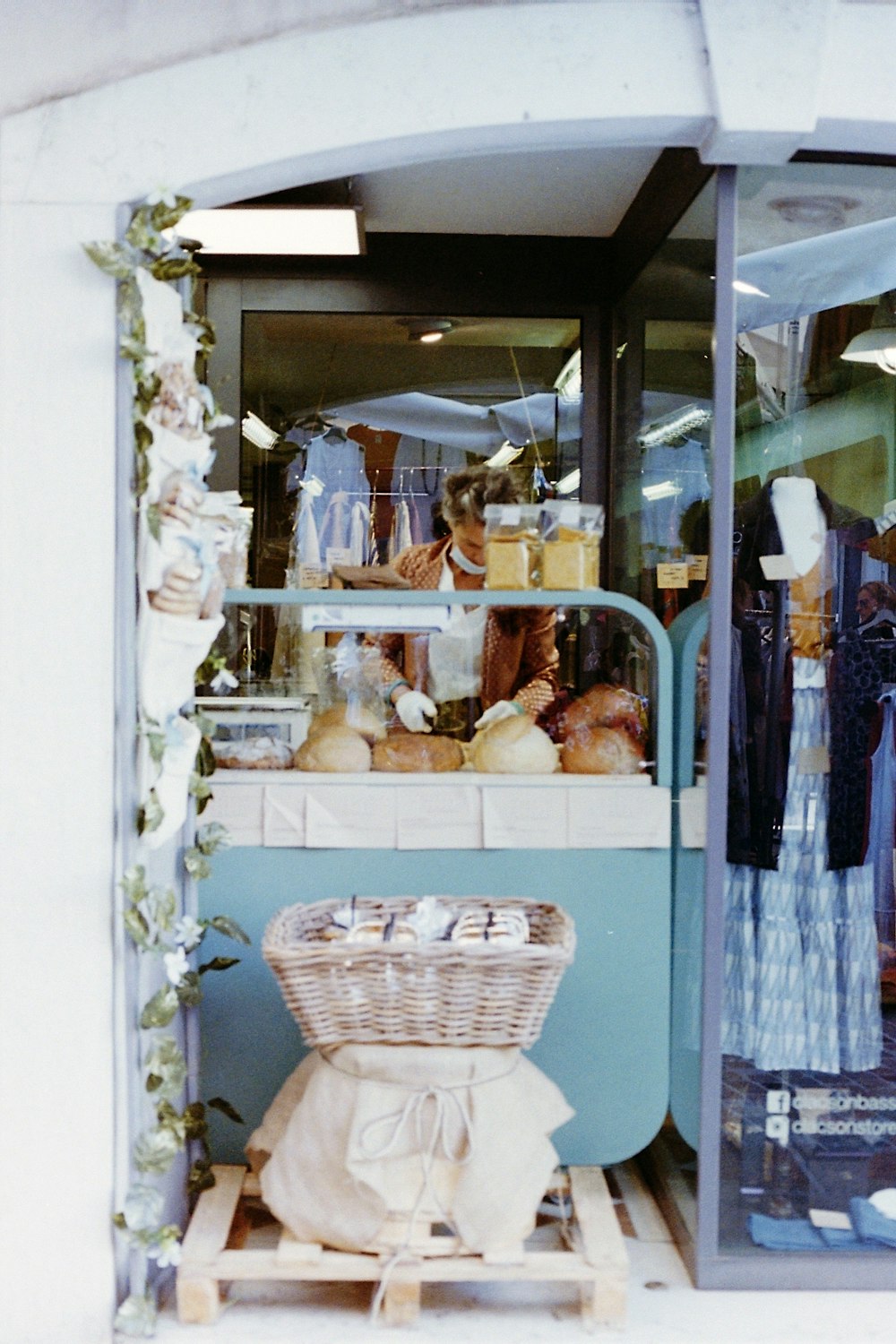 white wicker basket on blue wooden shelf