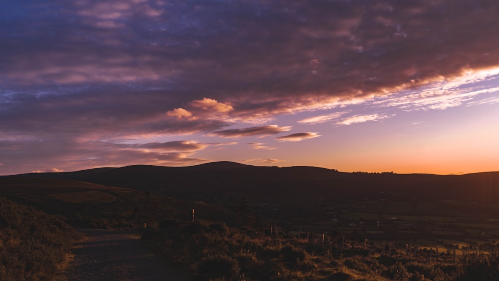 silhouette of mountain during sunset