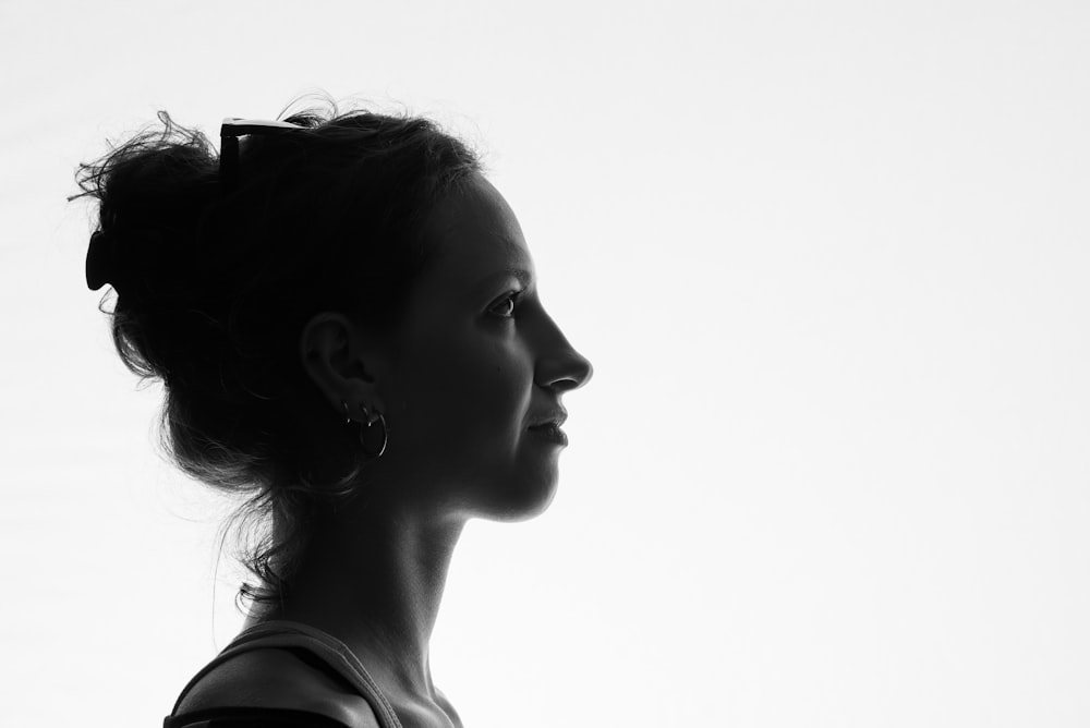 grayscale photo of woman in tank top