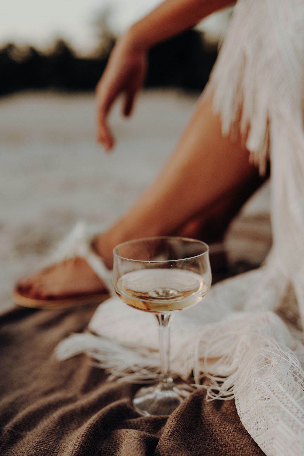 person holding clear wine glass