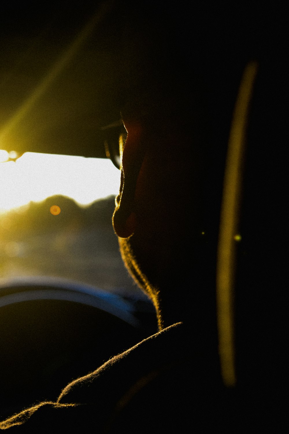 man in black framed eyeglasses looking at the sky during daytime