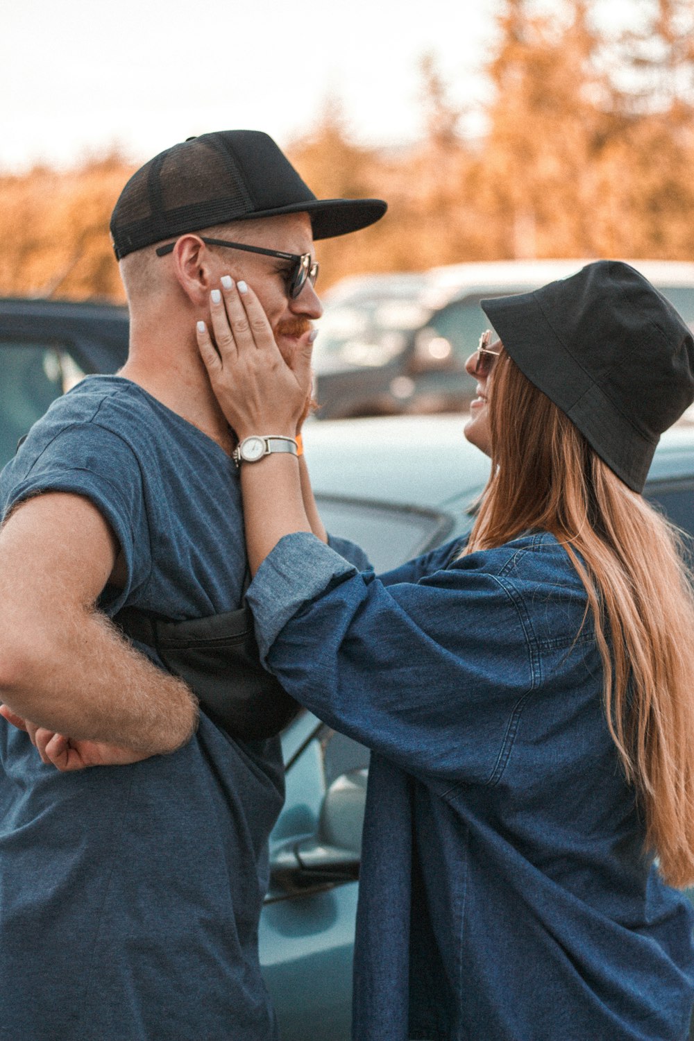 woman in blue shirt and black hat