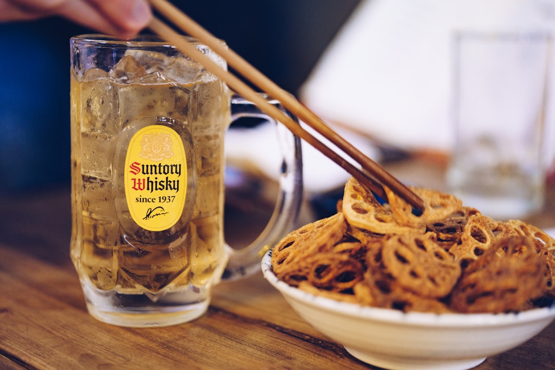 brown chopsticks on white ceramic bowl,