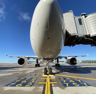 white airplane on airport during daytime