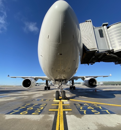 white airplane on airport during daytime