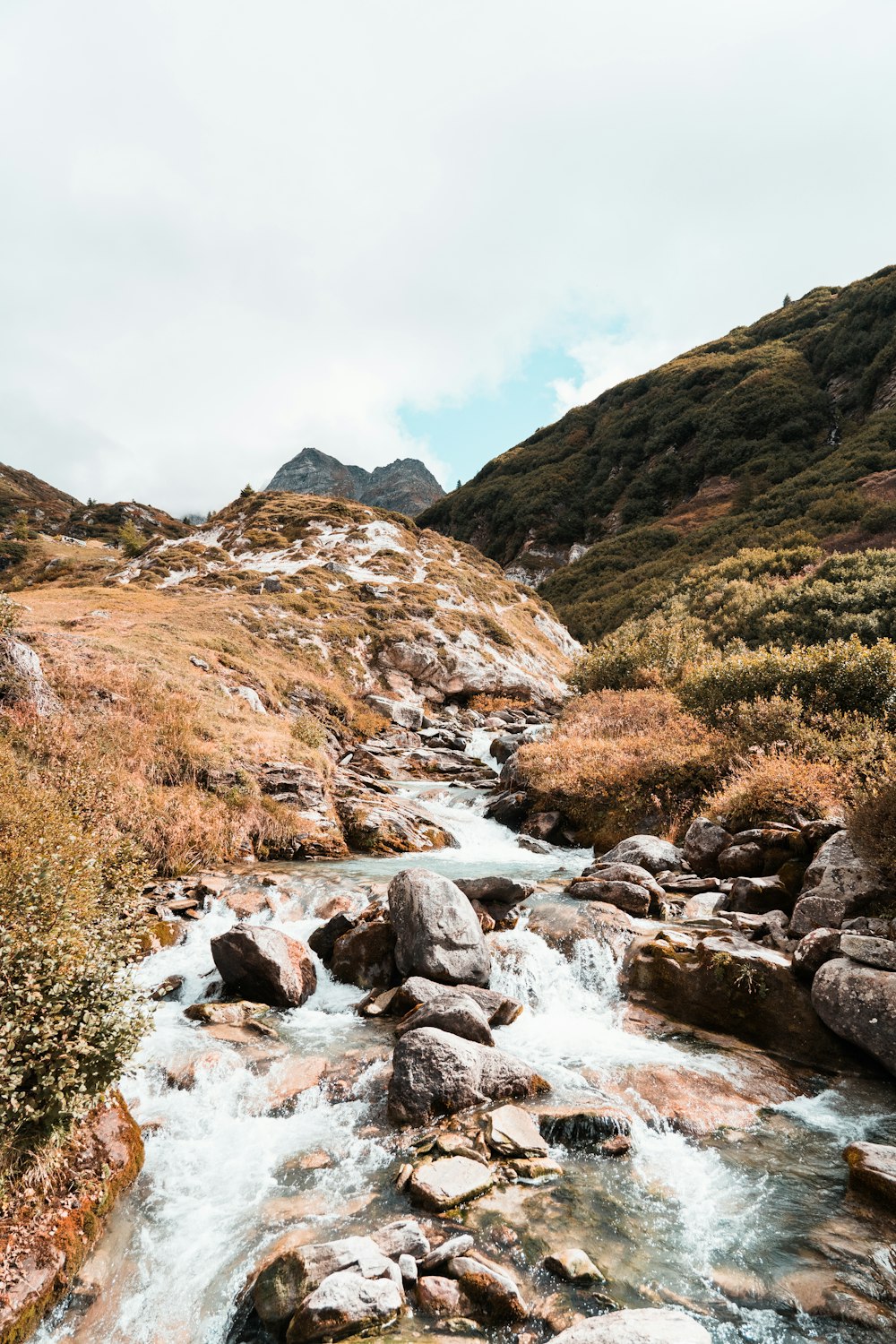 rocky river in the middle of mountains