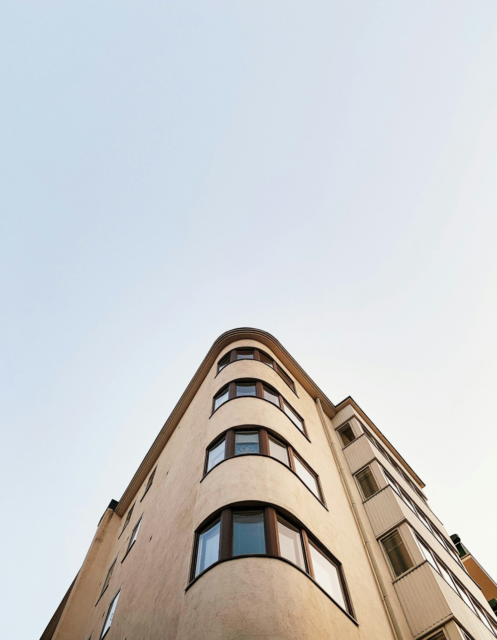 brown concrete building under white sky during daytime