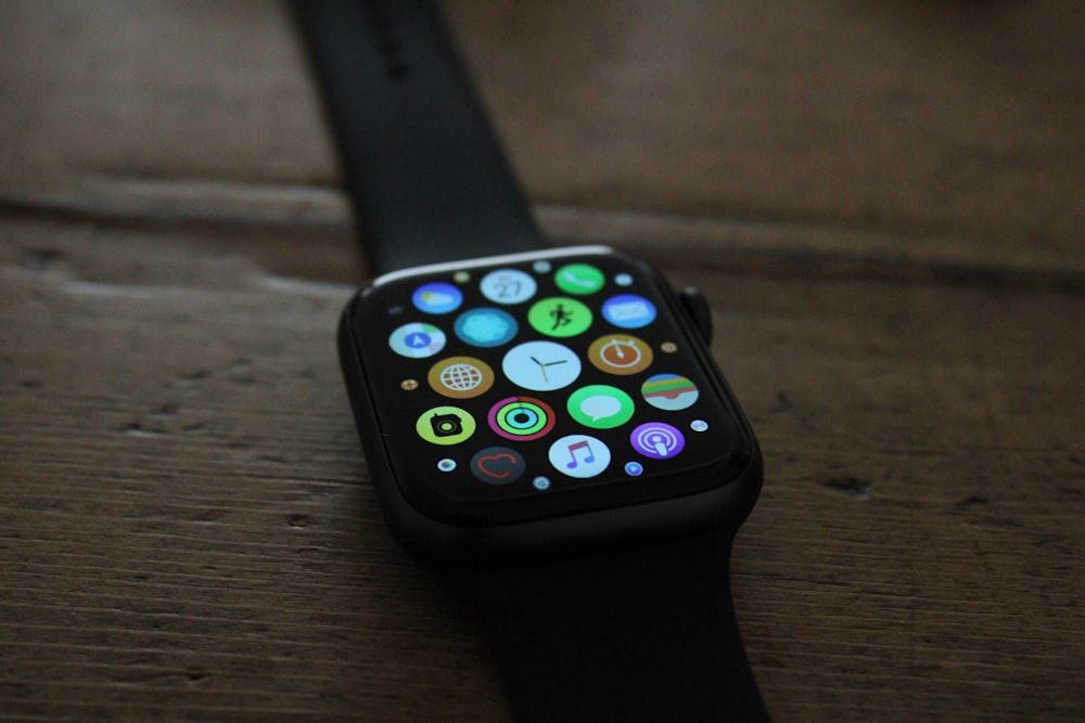 black apple watch with black sport band