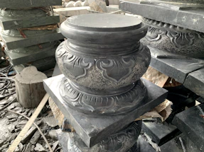 Elegant marble and onyx artisan workshop with tools and stone pieces.