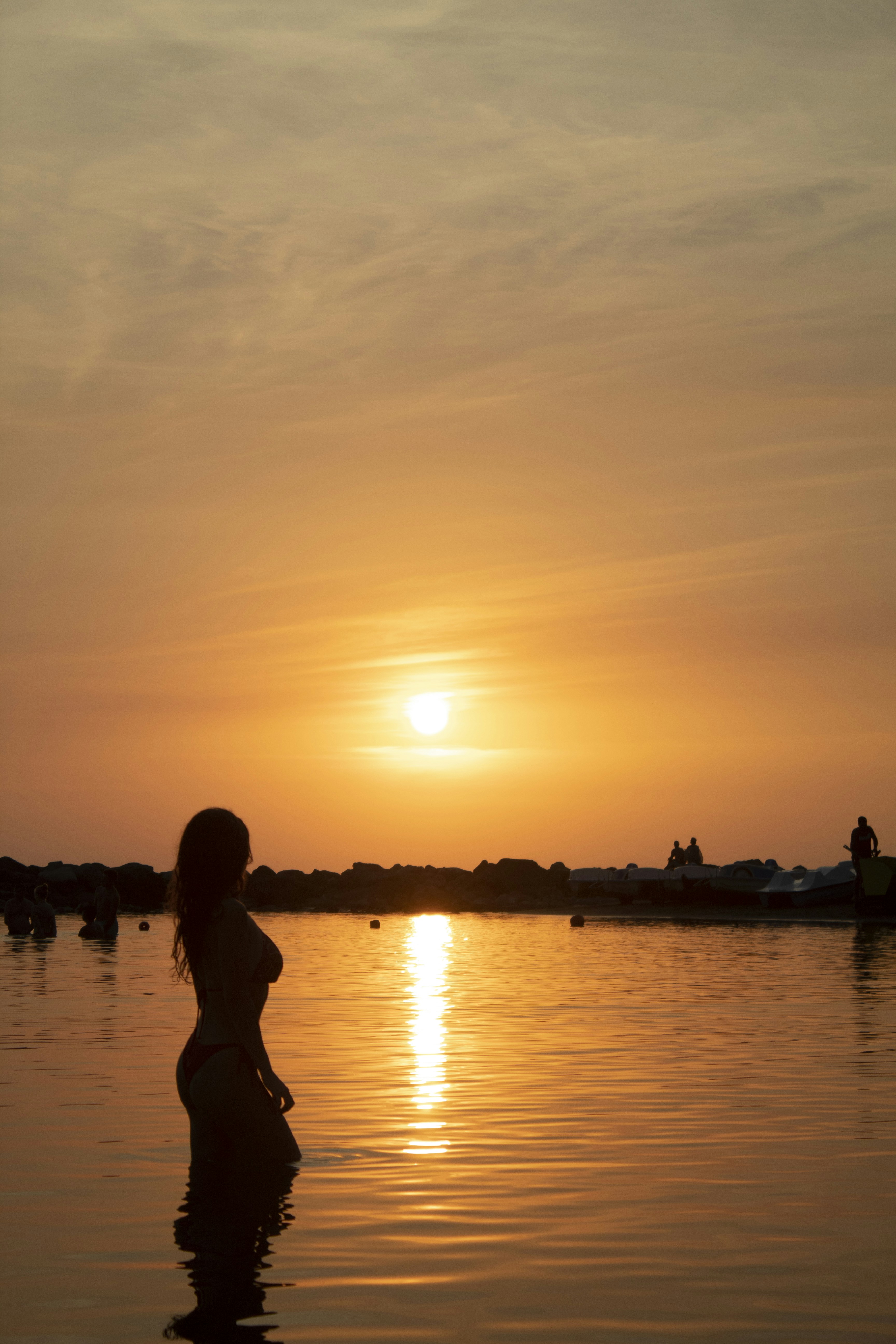 silhouette of people on beach during sunset