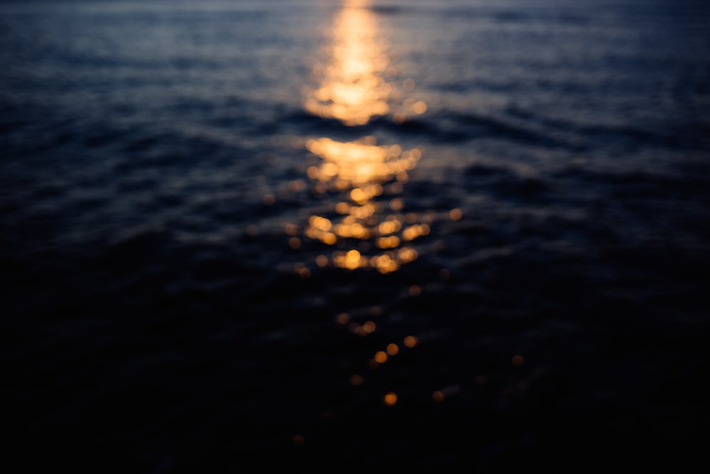 body of water during sunset