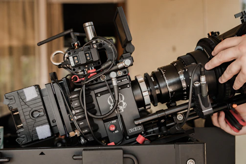 black dslr camera on black audio mixer