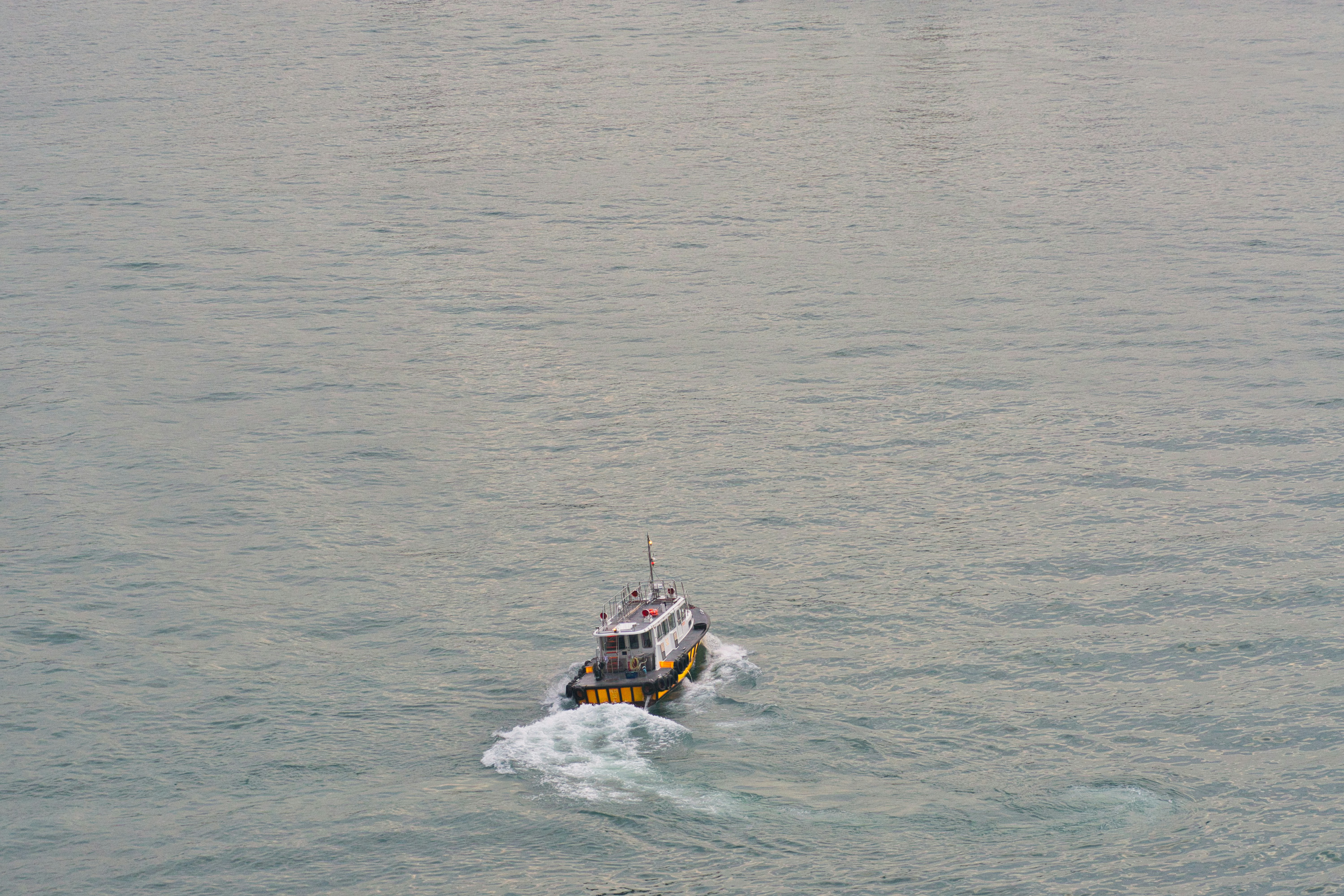 white and red boat on sea during daytime