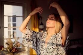 woman in black and white floral dress