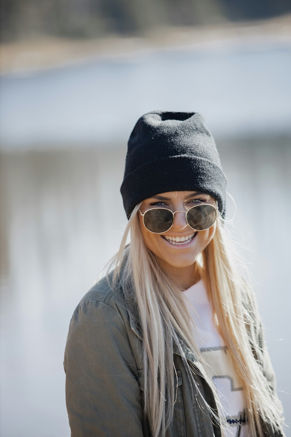 woman in black knit cap and black framed eyeglasses