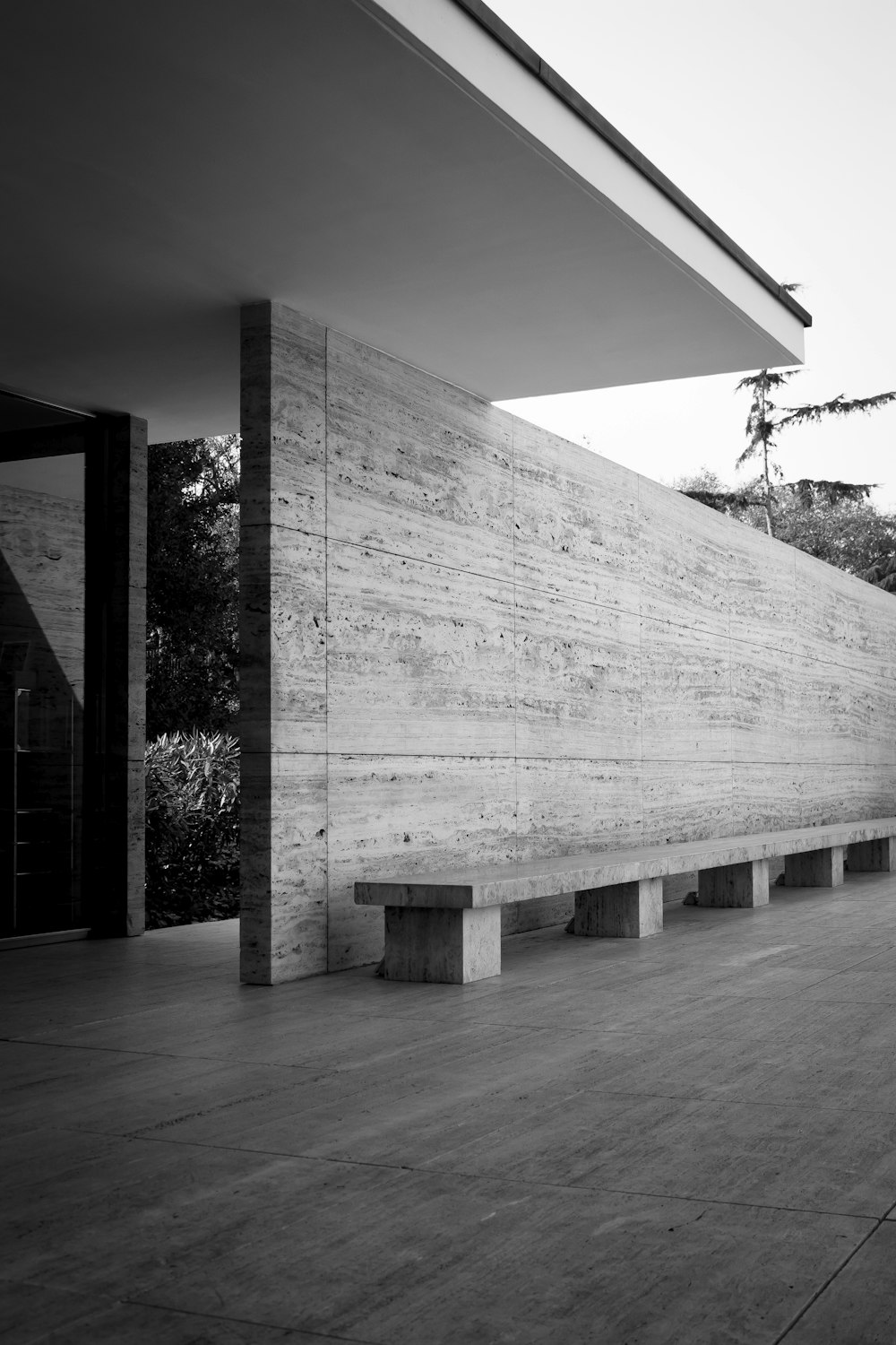 grayscale photo of wooden bench