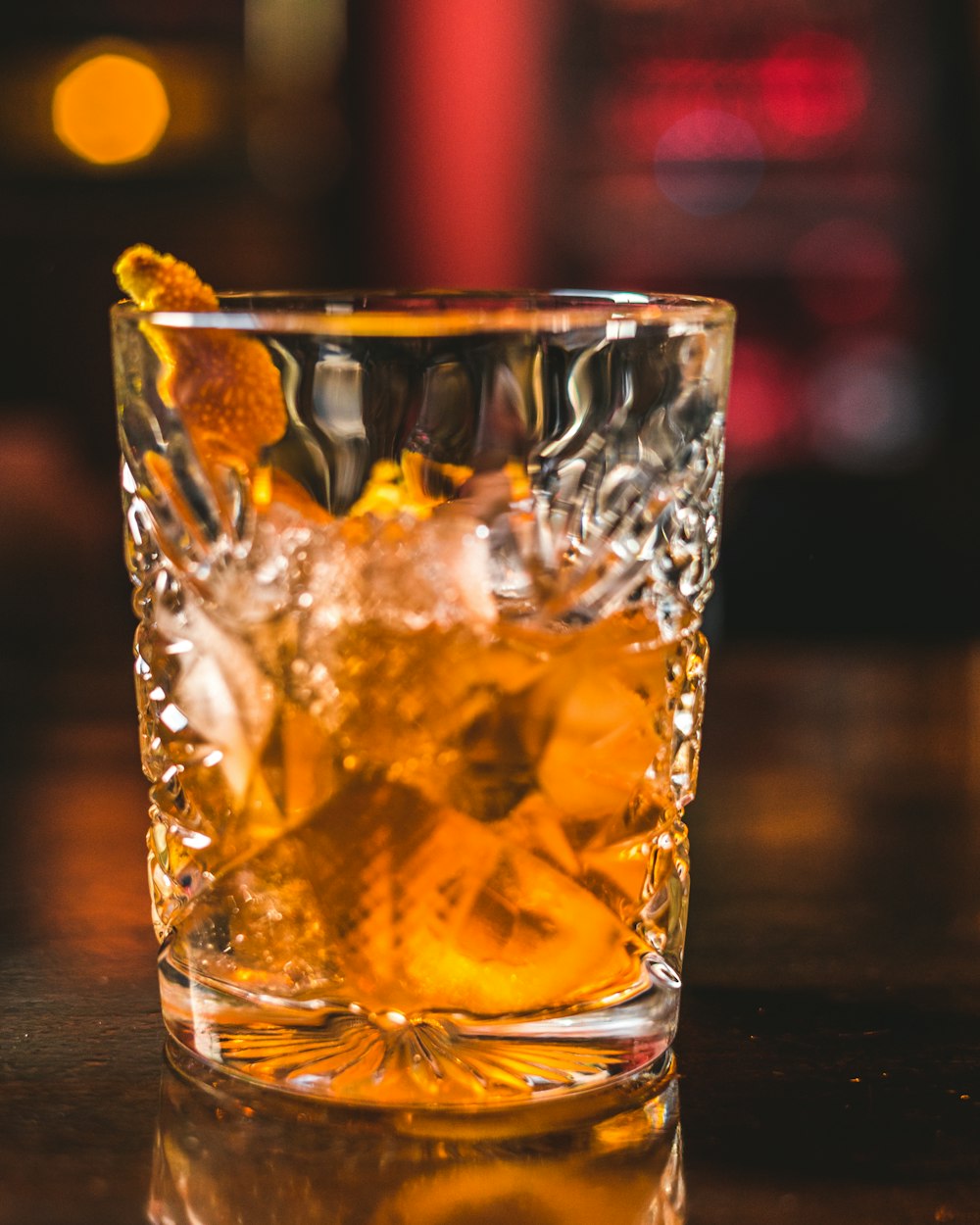 clear drinking glass with yellow liquid