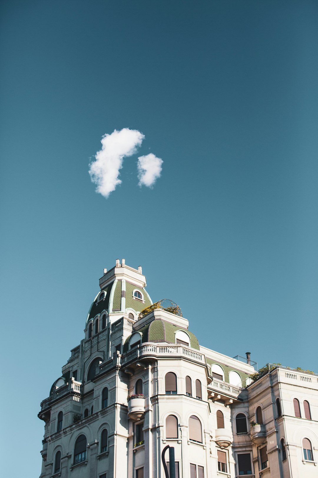 white concrete building under blue sky during daytime