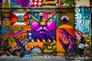 purple yellow and pink wall graffiti