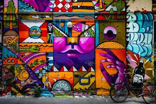 purple yellow and pink wall graffiti
