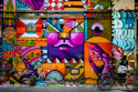 purple yellow and pink wall graffiti