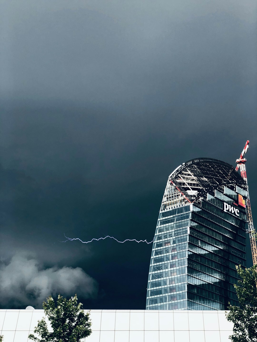 white and black concrete building under gray sky