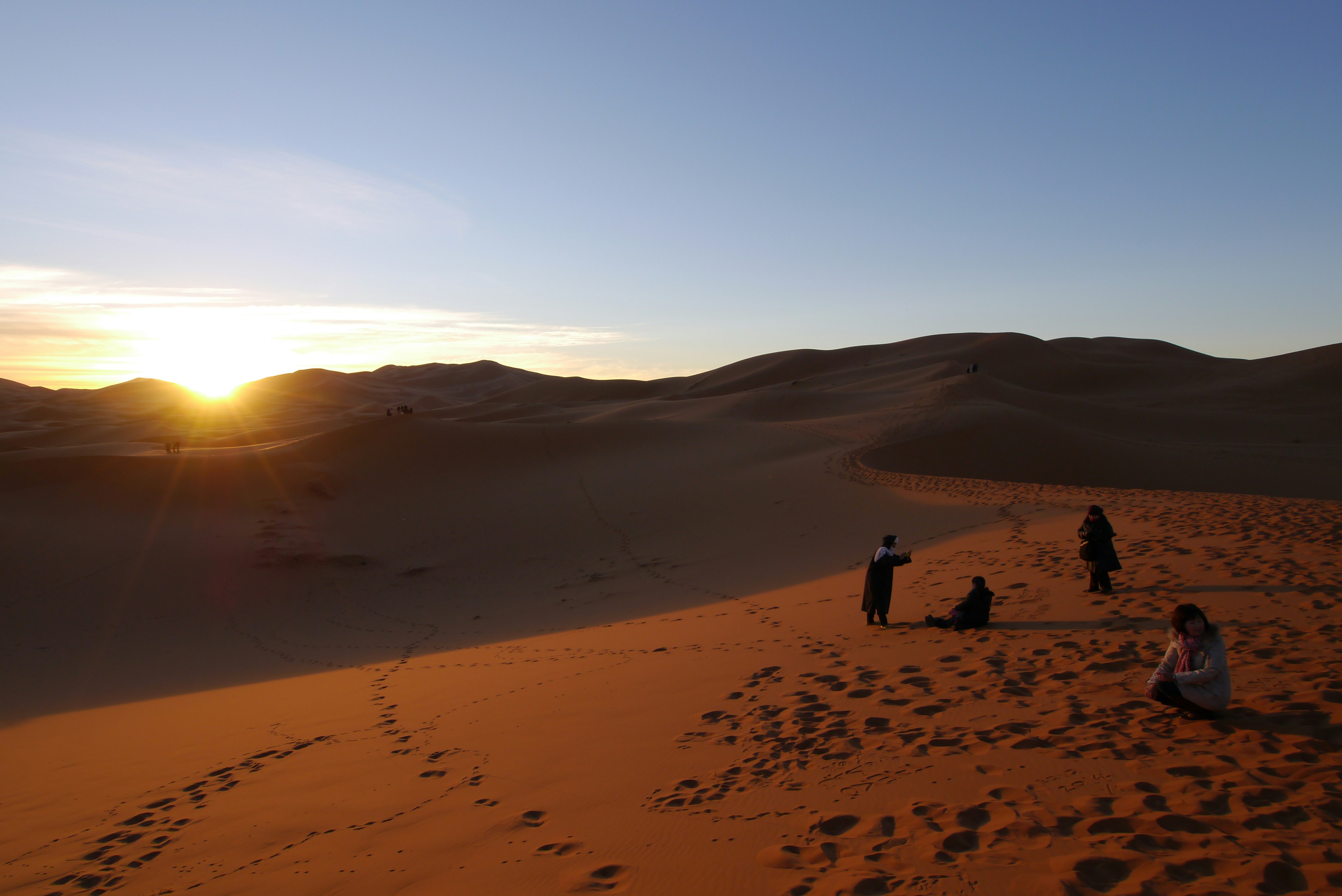 People walking on desert during daytime