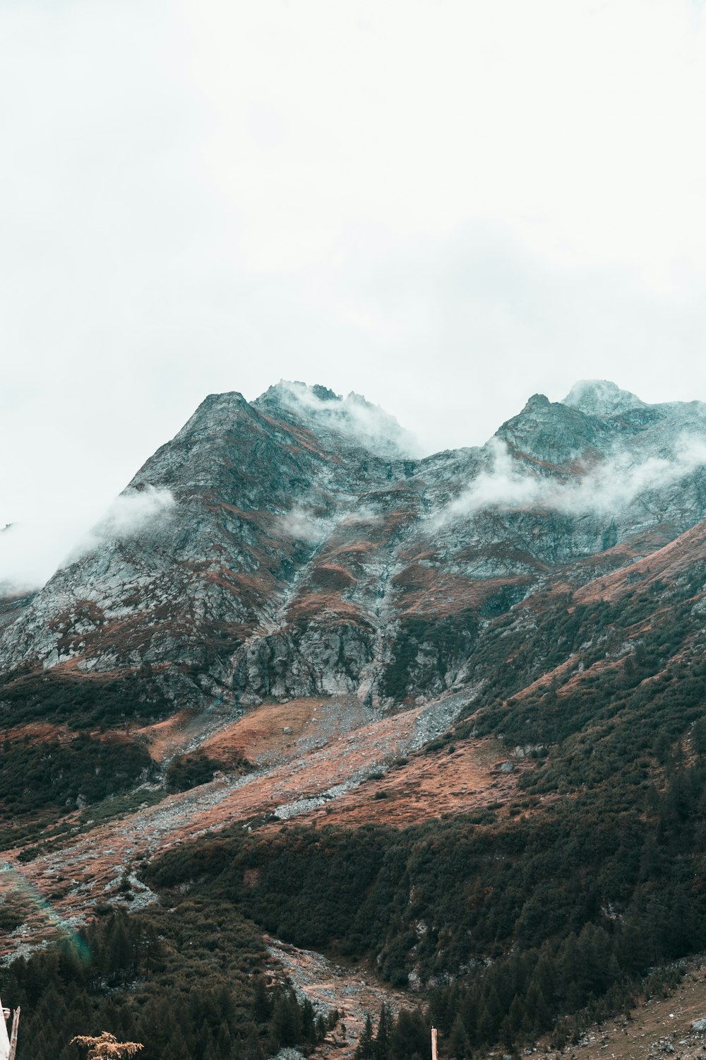 brown and gray mountain under white clouds during daytime