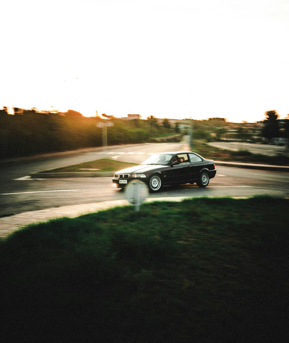 black coupe on road during daytime