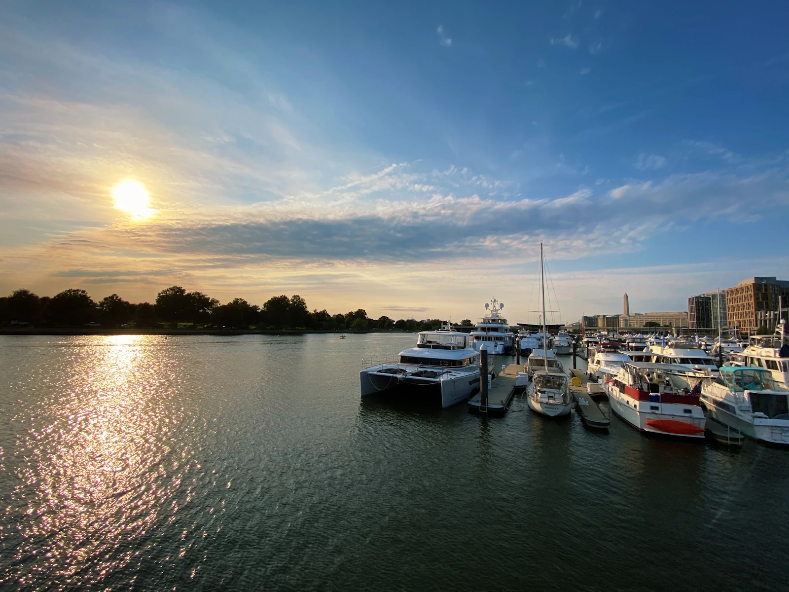 Boats at a Washington Channel marina during sunset