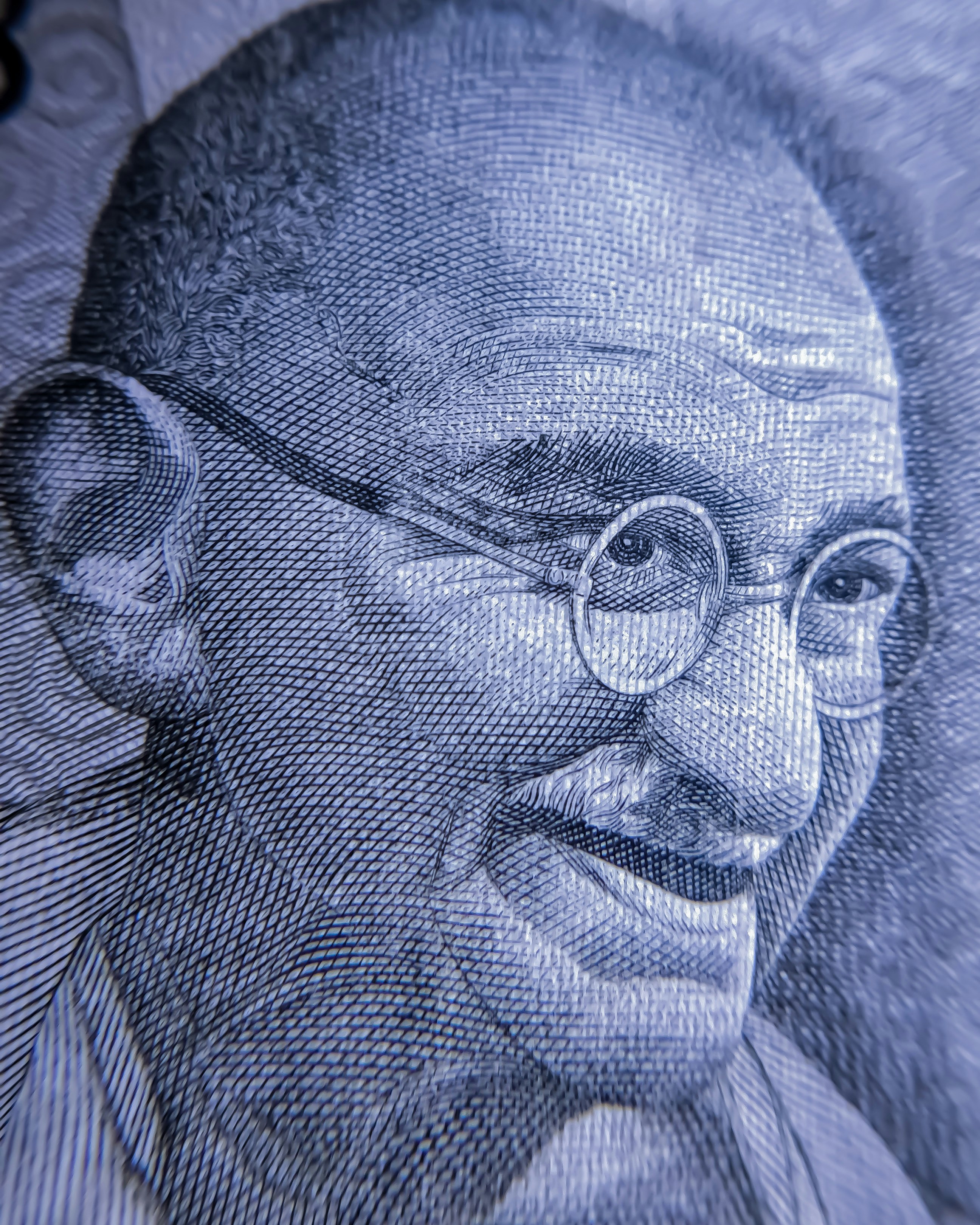 Retrato do Mahatma Gandhi cravado em cédula indiana