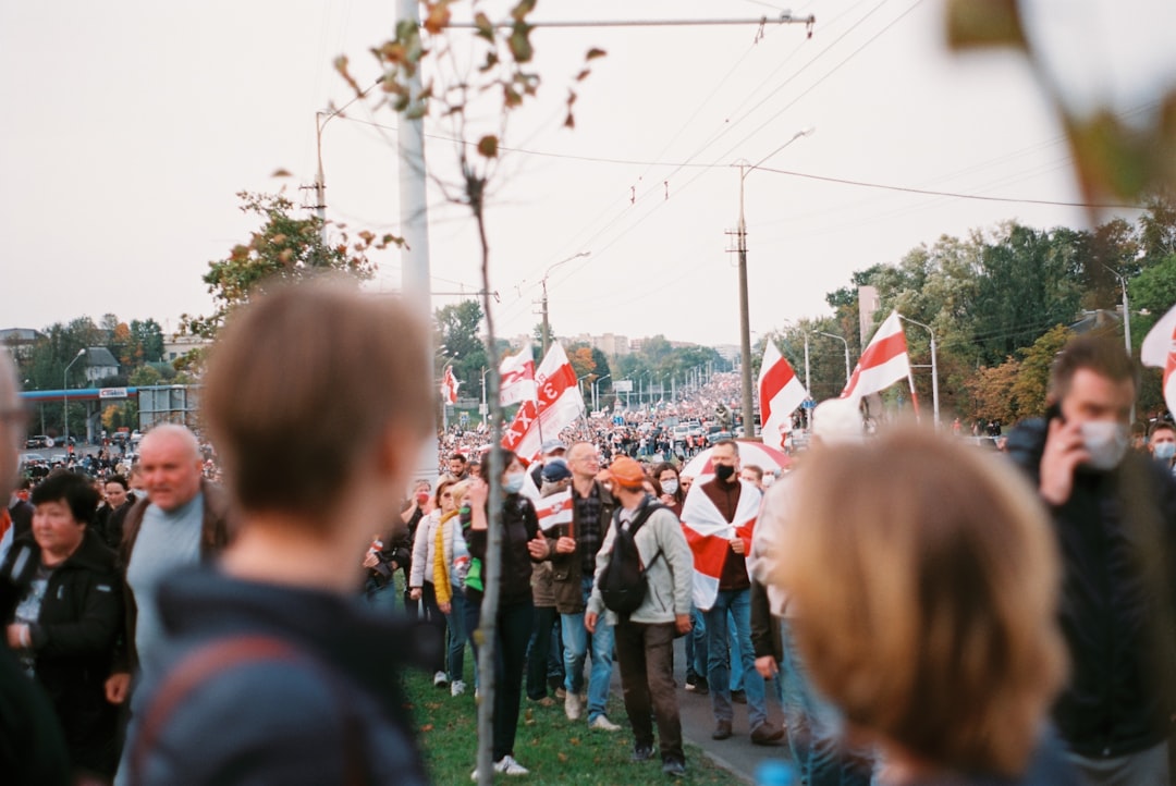 people gathering on green grass field during daytime