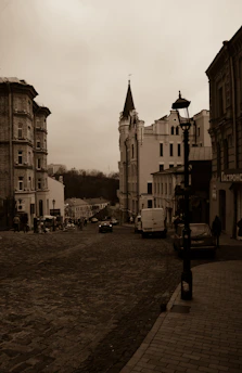 A sepia-toned historic photo of Enon Valley's main street bustling with early 20th-century life.