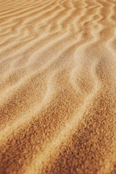 brown sand with shadow of person