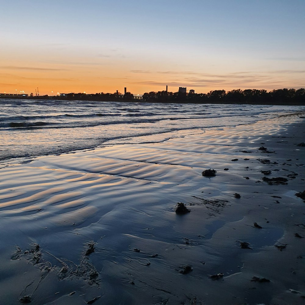 body of water during sunset