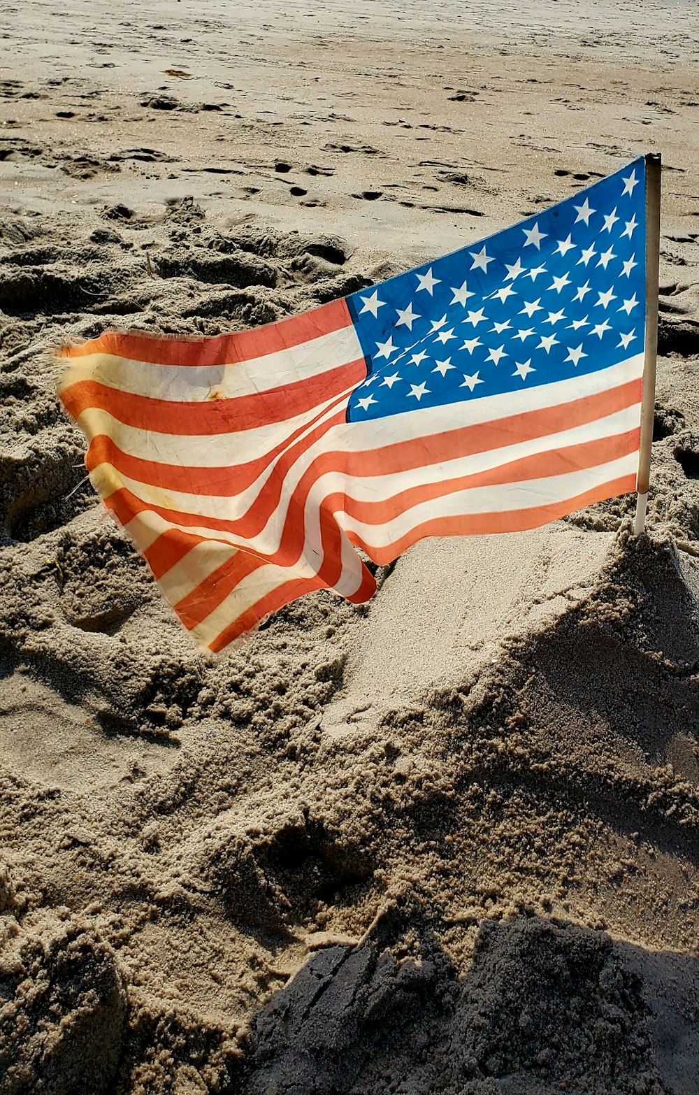 flag of us a on brown sand