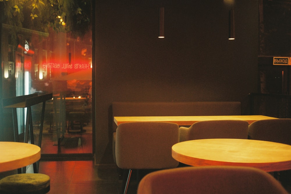 white and brown chairs near table