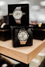black and white analog desk clock at 10 10