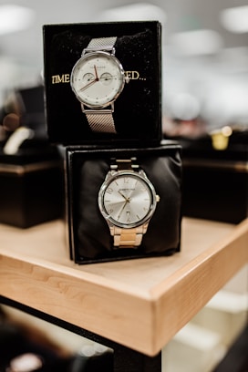 black and white analog desk clock at 10 10