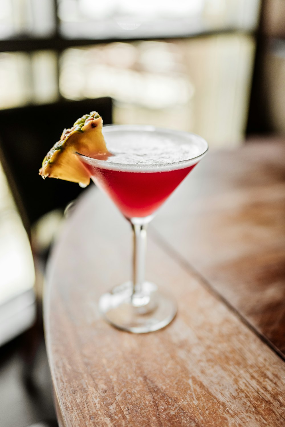 clear martini glass with red liquid